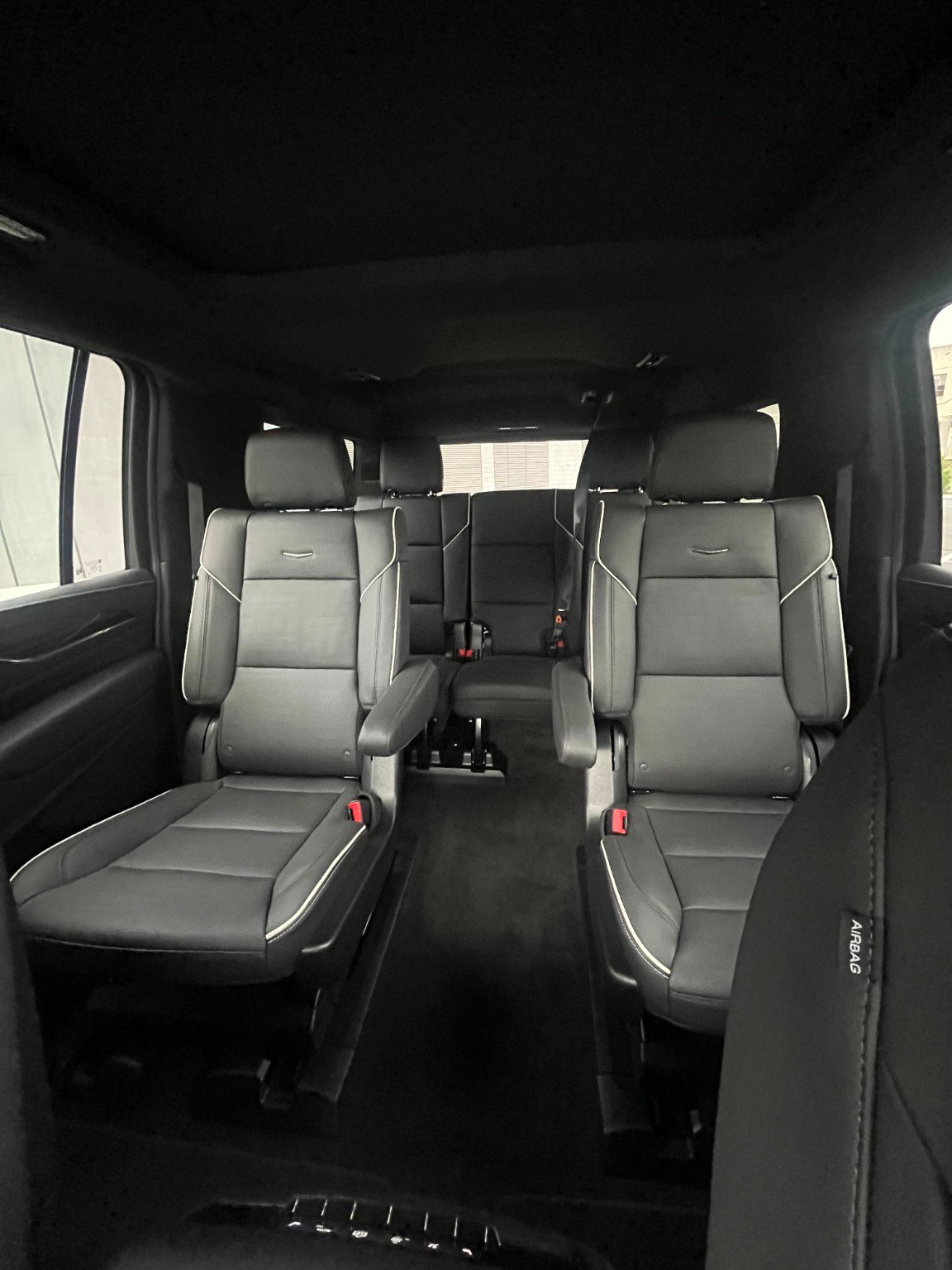 ELT Cadillac Escalade passenger cabin with black leather captain’s chairs and a third row